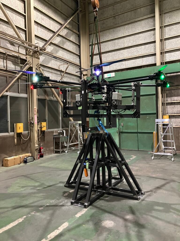 Large scale drone testing setup in industrial lab Large-scale drone testing setup in industrial environment, showing tethered drone evaluation and structural testing conditions for high payload UAV systems